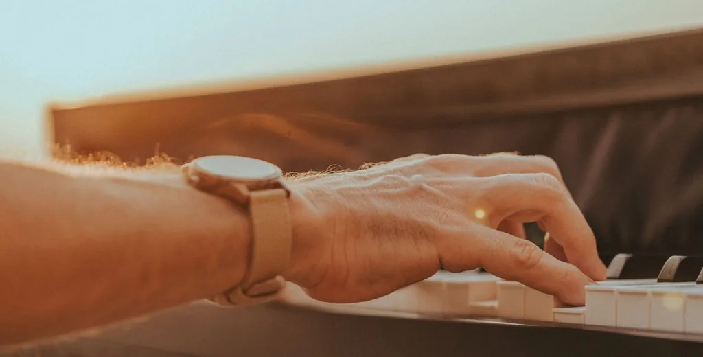 Piano keys with hands